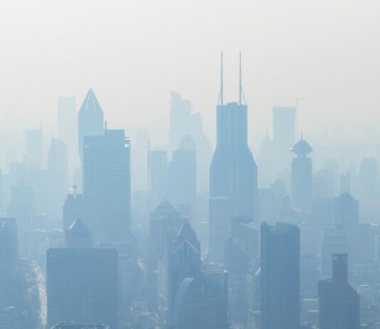 미세먼지 심한 봄철 건강관리 필수법? aerial view of high-rise buildings covered with smoke