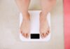 요요 없는 다이어트를 위한 운동 습관 만들기 person standing on white digital bathroom scale