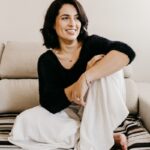 여성호르몬과 필라테스의 상관관계, 건강한 몸과 마음을 위한 균형 woman in black long sleeve shirt sitting on white couch